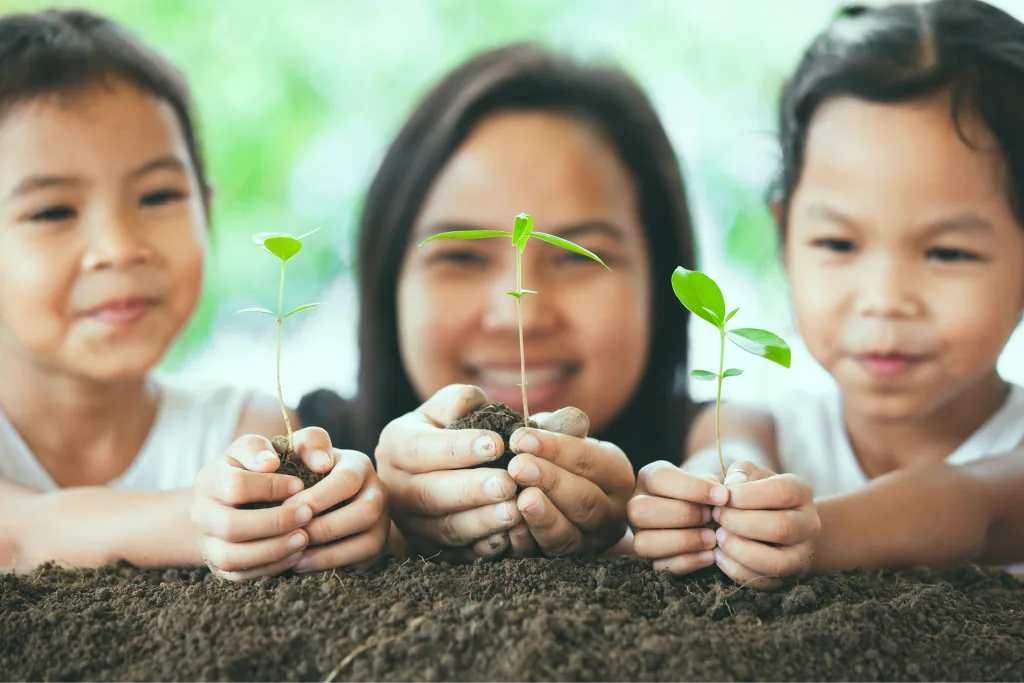 Children holding young seedlings